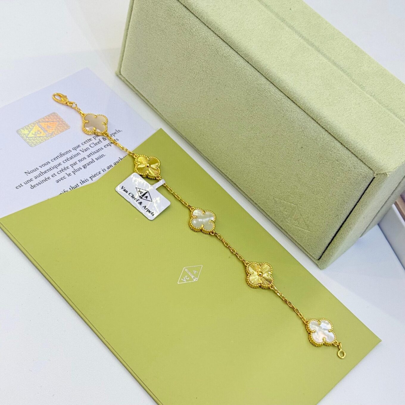 WhatsApp Image 2025-09-05 at 4.25.55 PM Van Cleef Alhambra White Marble & Silver Clover Gold Color Bracelet