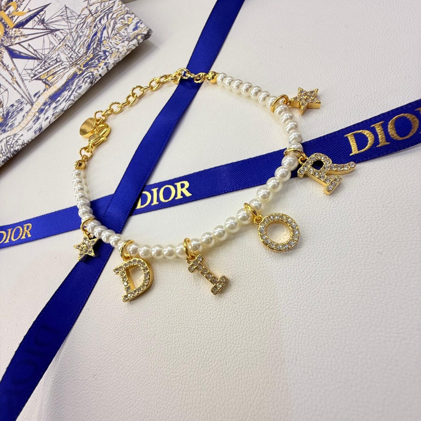 WhatsApp Image 2025-09-05 at 8.06.04 PM (1) Dior Pearl Star Gold Color Women’s Bracelet