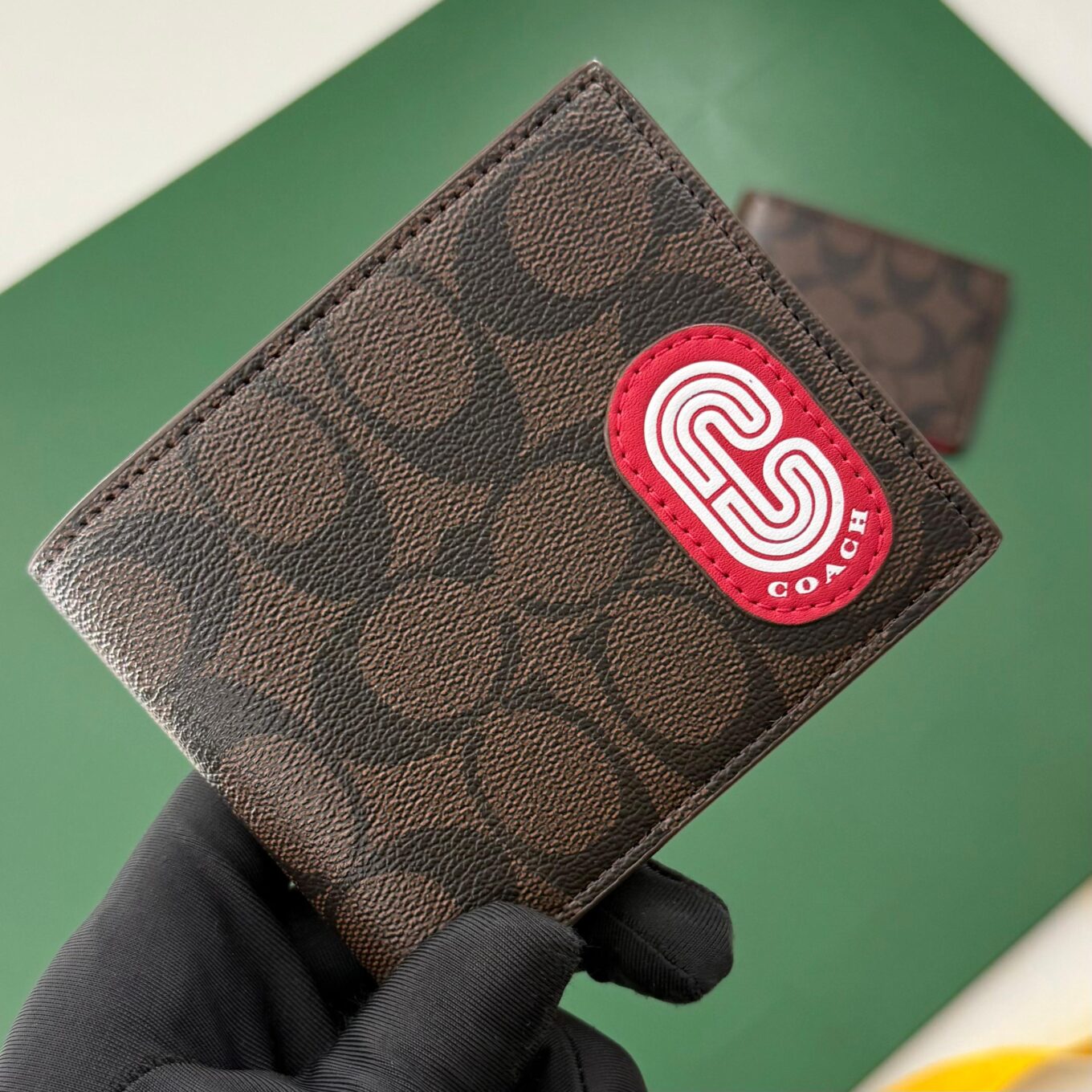 WhatsApp Image 2025-09-29 at 5.56.58 PM Coach Coffee Canvas Red Patch Men’s Wallet With Card Holder